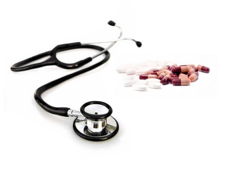 doctors stethoscope with pills
