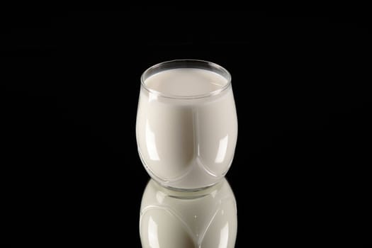 milk glass on black background