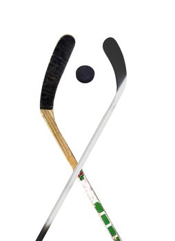 Hockey stick and puck on white