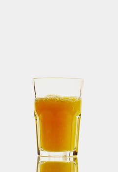 Glass with orange juice isolated on the white