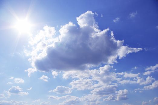 Blue sky background with tiny clouds