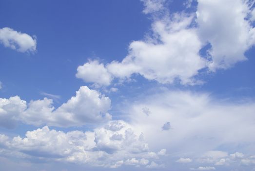 Blue sky background with tiny clouds
