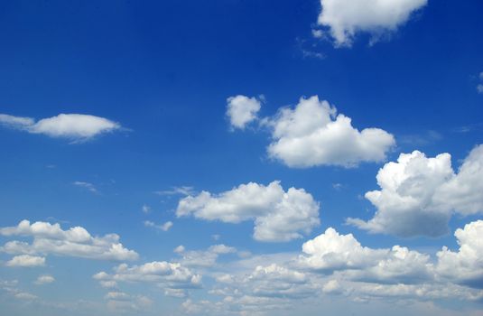 blue sky background with tiny clouds