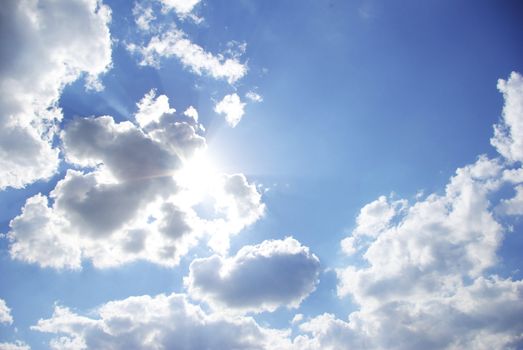 Blue sky background with tiny clouds