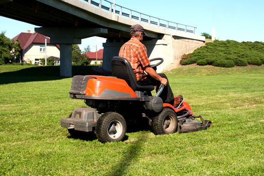 Man on a riding lawn mower