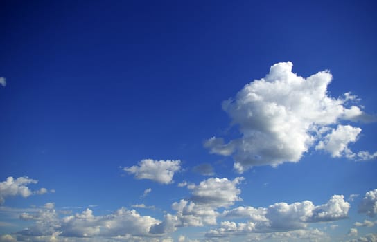 blue sky background with tiny clouds