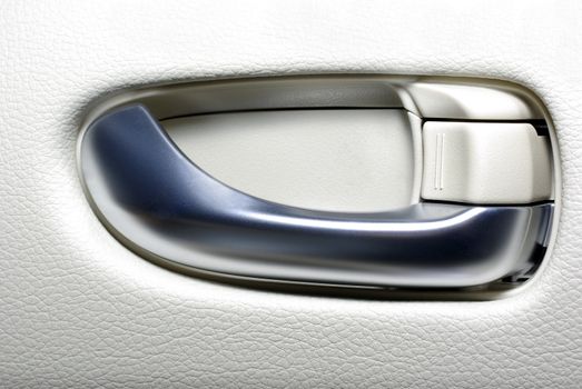 Aluminium door handle of modern japanese car. Abstract background.