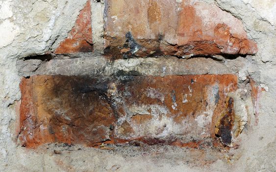 Concrete brick wall with damaged beton plaster. Abstract textured background.