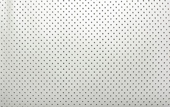 High quality perforated beige leather. Interior of modern japanese car. Background or backdrop.