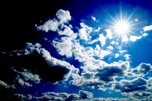 blue sky background with tiny clouds