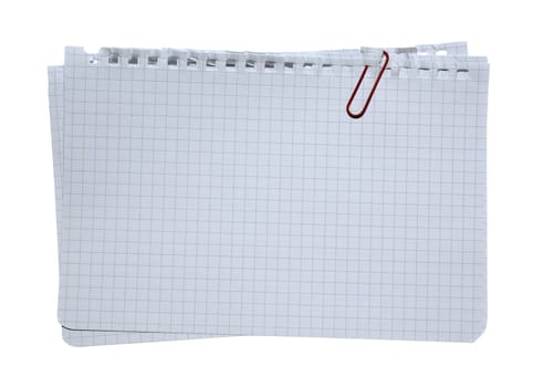 Checked note paper stacked with red clip isolated on white background.