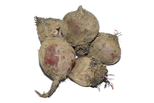 Stack of dirty raw beet isolated on white background.