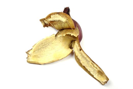 Red banana peel isolated on white background.