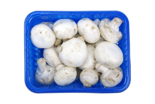 Champignon mushrooms in blue pack isolated on white background.