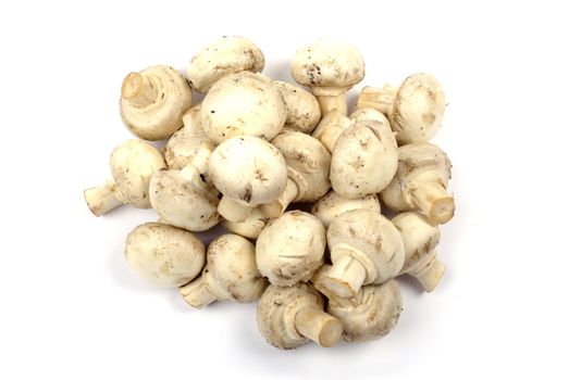 Heap of champignon mushrooms isolated on white background.