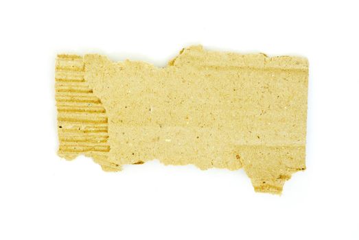 Ripped piece of cardboard on white