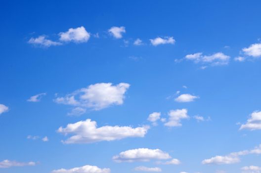 blue sky background with tiny clouds