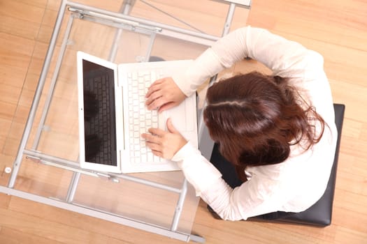 Business woman working on a Laptop.