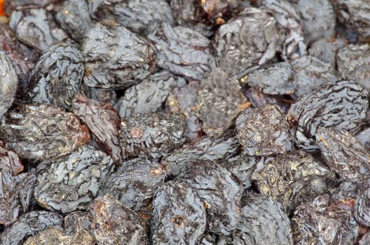 a closeup of dark brown raisins