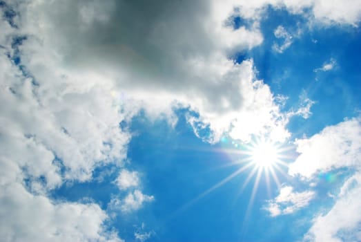 Blue sky background with tiny clouds