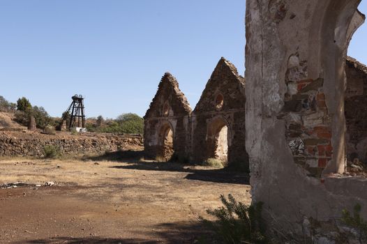 Damaged buildings in São Domingos Mine, a deserted open-pit mine in Mertola, Alentejo, Portugal. This site is one of the volcanogenic massive sulfide ore deposits in the Iberian Pyrite Belt, which extends from the southern Portugal into Spain