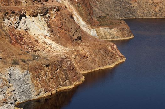 Detail of the São Domingos Mine, a deserted open-pit mine in Mertola, Alentejo, Portugal. This site is one of the volcanogenic massive sulfide ore deposits in the Iberian Pyrite Belt, which extends from the southern Portugal into Spain