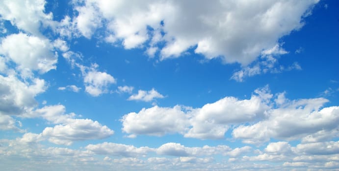 blue sky background with tiny clouds