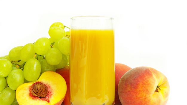 Glass with freshly made peach juice on a white background