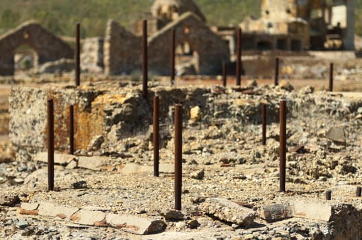 Damaged buildings in São Domingos Mine, a deserted open-pit mine in Mertola, Alentejo, Portugal. This site is one of the volcanogenic massive sulfide ore deposits in the Iberian Pyrite Belt, which extends from the southern Portugal into Spain