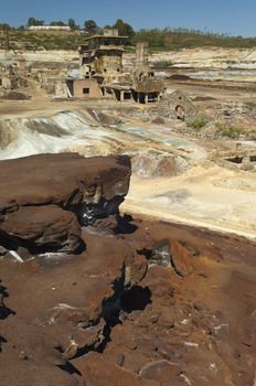 Damaged buildings in São Domingos Mine, a deserted open-pit mine in Mertola, Alentejo, Portugal. This site is one of the volcanogenic massive sulfide ore deposits in the Iberian Pyrite Belt, which extends from the southern Portugal into Spain