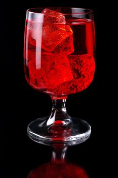 Glass of red drink with ice closeup (C3)