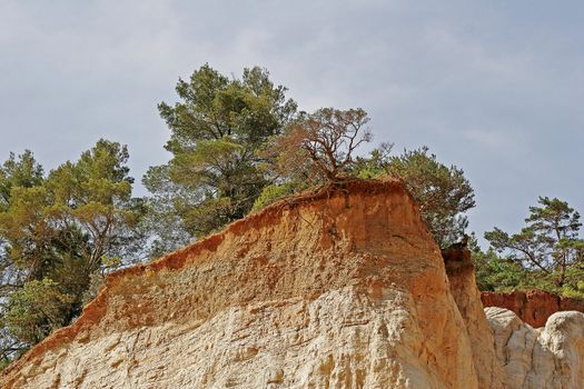 Ocher rock in Provence with Rustrel. Ockerfelsen bei Rustel, Provence