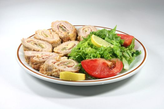 diner plate with roll meat and green salad