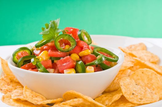 Delicious homemade salsa served with corn chips.