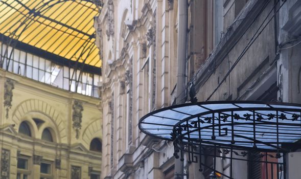 Iamge of colorful glass roofs in Macca-Villacrosse passage in Bucharest,Romania.Selective focus on the blue roof.