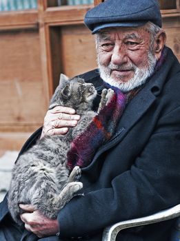 Ankara Turkey  April 2008 -  old turkish man holding a cat