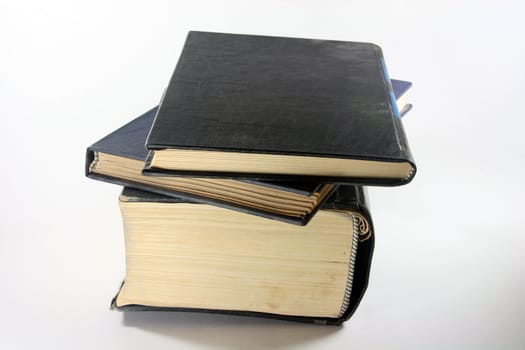 three old books closeup in white background