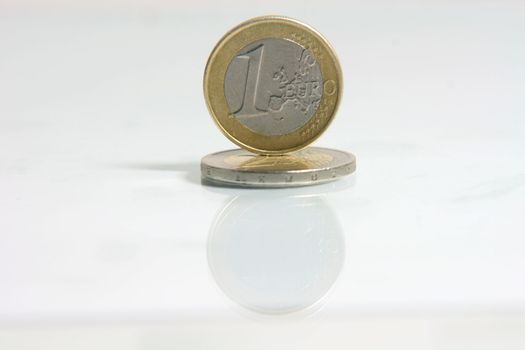 business concepts one euro coin with reflection