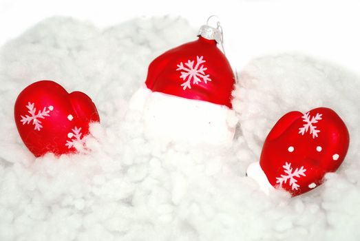 Santa's clothe ornaments are in snow.  
