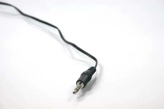 headphones plug with black cable in white background