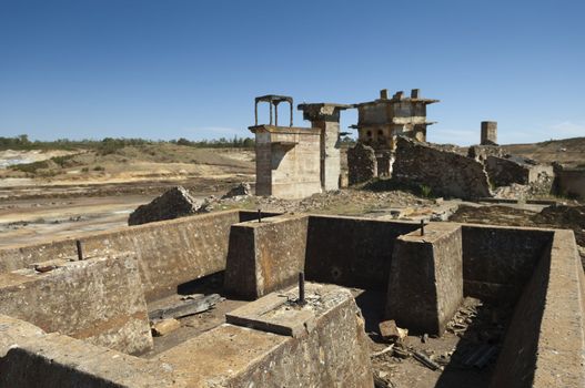 Damaged buildings in São Domingos Mine, a deserted open-pit mine in Mertola, Alentejo, Portugal. This site is one of the volcanogenic massive sulfide ore deposits in the Iberian Pyrite Belt, which extends from the southern Portugal into Spain
