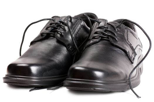 A pair of black shoes with black laces