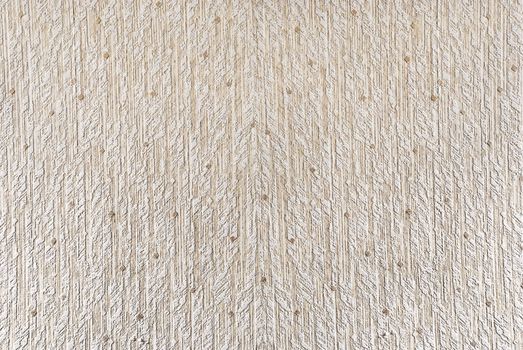 Natural textured light colored wallpaper.