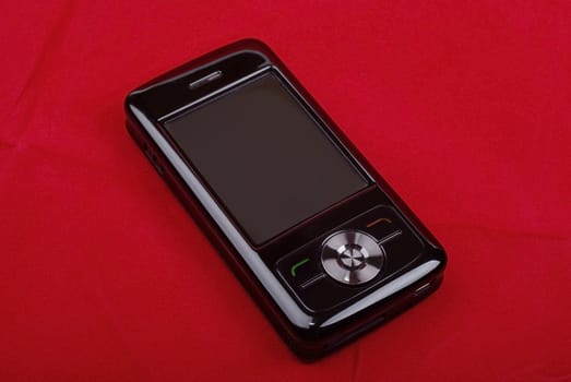 Black luxury pda phone isolated on red background.