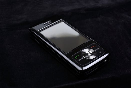 Luxury glossy pda phone isolated on black velvet background.