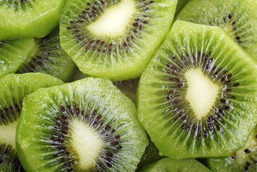 Abstract fresh sliced kiwi close up background.