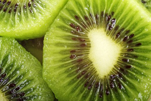 Abstract fresh kiwi macro photo as background.