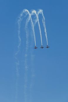 3 Acrobatic extra 300 falling together on airshow
