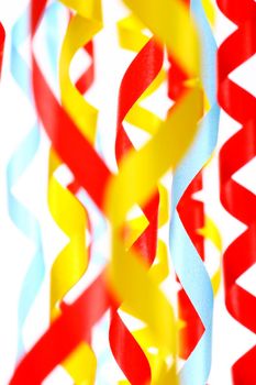 Celebratory streamer of red green and yellow color on a white background (look similar images in my portfolio)