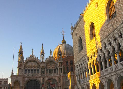 The magnificent light of dusk shining on St. Mark's cathedral in Venice, Italy.